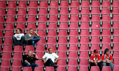 COLOGNE, GERMANY - AUGUST 10: Spectators watch the Second Bundesliga match between 1. FC Koeln and SV Sandhausen at RheinEnergieStadion on August 10, 2012 in Cologne, Germany. (Photo by Dennis Grombkowski/Bongarts/Getty Images)