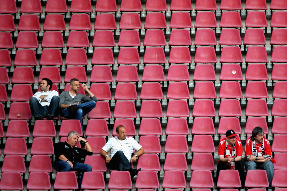 COLOGNE, GERMANY - AUGUST 10: Spectators watch the Second Bundesliga match between 1. FC Koeln and SV Sandhausen at RheinEnergieStadion on August 10, 2012 in Cologne, Germany. (Photo by Dennis Grombkowski/Bongarts/Getty Images)