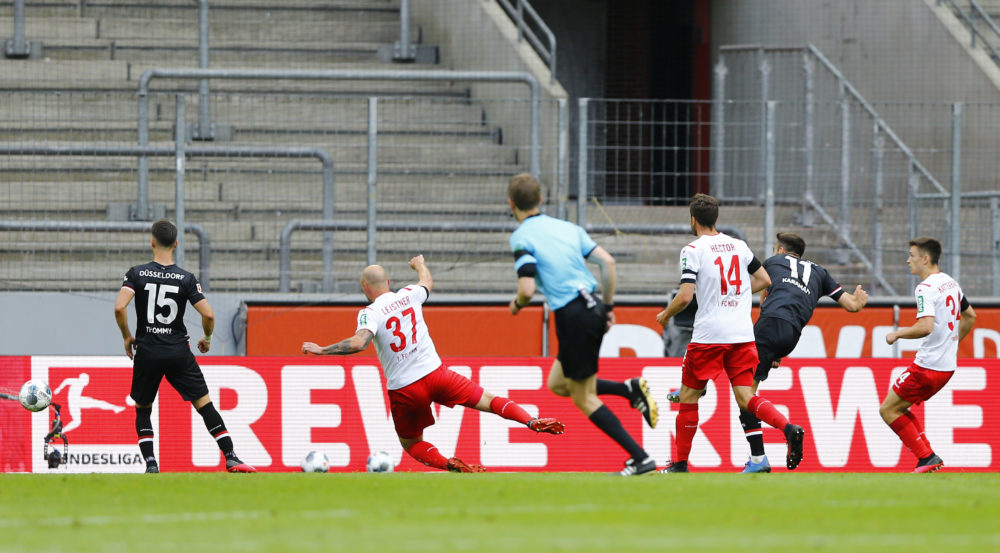 COLOGNE, GERMANY - MAY 24: Kenan Karaman of Fortuna Dusseldorf scores their first goal during the Bundesliga match between 1. FC Koeln and Fortuna Duesseldorf at RheinEnergieStadion on May 24, 2020 in Cologne, Germany. (Photo by Pool/Thilo Schmuelgen/Pool via Getty Images)