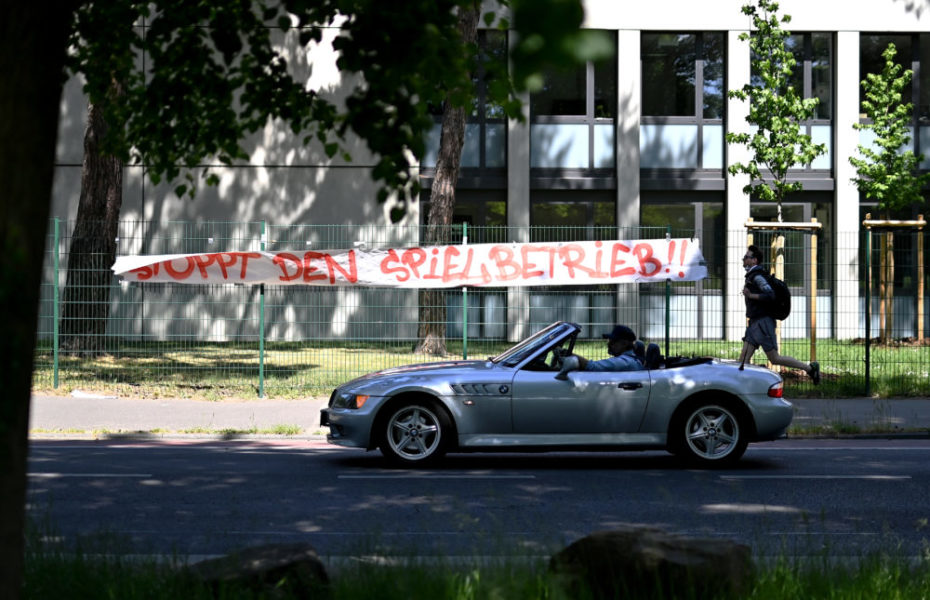 COLOGNE, GERMANY - MAY 17: A protest banner against the restart of the Bundesliga seen near the RheinEnergieStadion on May 17, 2020 in Cologne, Germany. The Bundesliga and Second Bundesliga is the first professional league to resume the season after the nationwide lockdown due to the ongoing Coronavirus (COVID-19) pandemic. All matches until the end of the season will be played behind closed doors. (Photo by Lukas Schulze/Getty Images)
