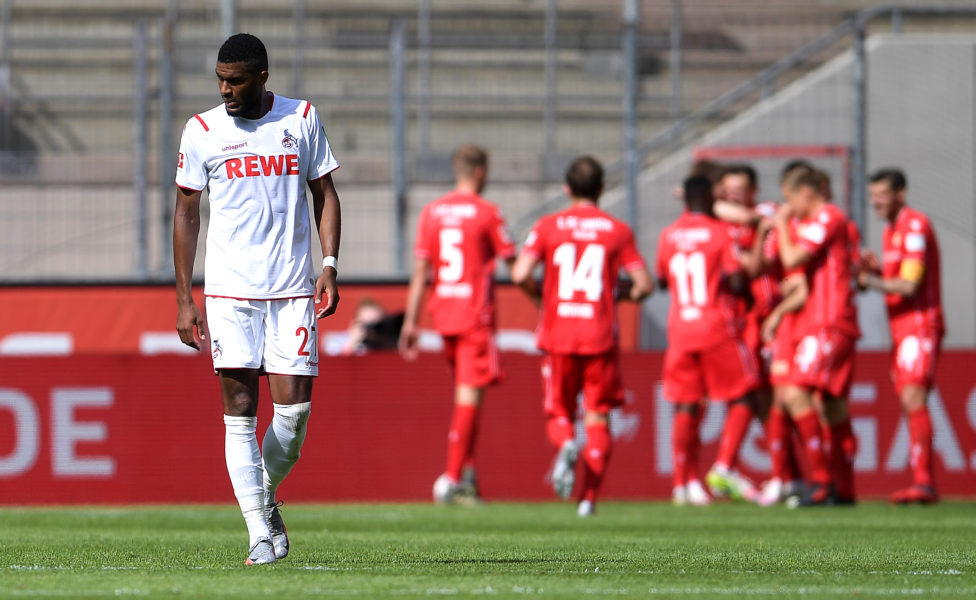COLOGNE, GERMANY - JUNE 13: Anthony Modeste of 1. FC Koeln reacts as Christian Gentner of 1.FC Union Berlin (background) celebrates with his team mates after scoring his team's second goal during the Bundesliga match between 1. FC Koeln and 1. FC Union Berlin at RheinEnergieStadion on June 13, 2020 in Cologne, Germany. (Photo by Alexander Scheuber/Getty Images)