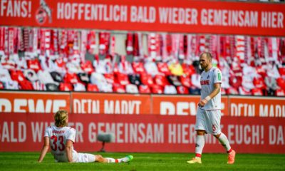 Cologne's German defender Rafael Czichos (R) and Cologne's Belgian defender Sebastiaan Bornauw react after the German first division Bundesliga football match FC Cologne v Eintracht Frankfurt on June 20, 2020 in Cologne, western Germany. (Photo by Sascha SCHÜRMANN / various sources / AFP) / DFL REGULATIONS PROHIBIT ANY USE OF PHOTOGRAPHS AS IMAGE SEQUENCES AND/OR QUASI-VIDEO (Photo by SASCHA SCHURMANN/AFP via Getty Images)