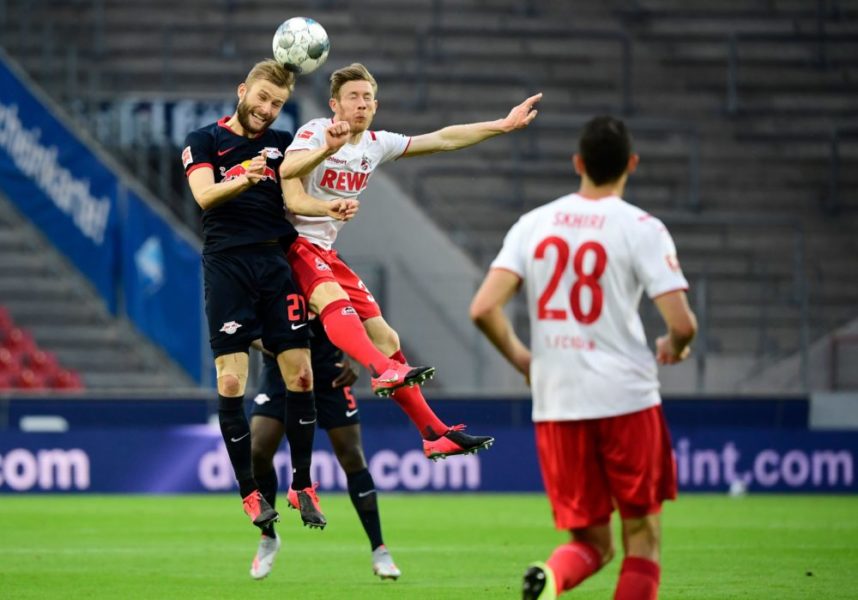 Leipzig's Austrian midfielder Konrad Laimer (L) and Cologne's Austrian midfielder Florian Kainz vie for the ball during the German first division Bundesliga football match FC Cologne vs RB Leipzig, in Cologne on June 1, 2020. (Photo by Ina FASSBENDER / various sources / AFP) / DFL REGULATIONS PROHIBIT ANY USE OF PHOTOGRAPHS AS IMAGE SEQUENCES AND/OR QUASI-VIDEO (Photo by INA FASSBENDER/AFP via Getty Images)