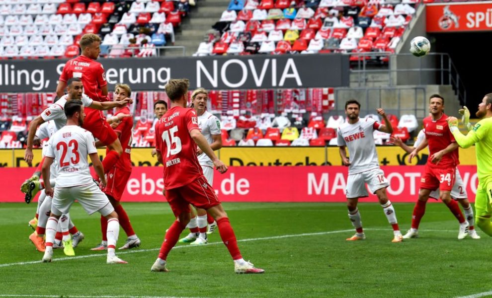 Union's Marvin Friedrich (topL) scores the opening goal during the German first division Bundesliga football match FC Cologne v FC Union Berlin on June 13, 2020 in Cologne, western Germany. (Photo by Martin Meissner / POOL / AFP) / DFL REGULATIONS PROHIBIT ANY USE OF PHOTOGRAPHS AS IMAGE SEQUENCES AND/OR QUASI-VIDEO (Photo by MARTIN MEISSNER/POOL/AFP via Getty Images)