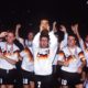 Pierre Littbarski holds up the trophy GER Lothar Matthaeus right, Rudi Voeller left, Andreas Brehme 2nd left Argentina v West Germany. World Cup Final 1990. Rome. 8/7/90. PUBLICATIONxINxGERxSUIxAUTxHUNxPOLxUSAxONLY