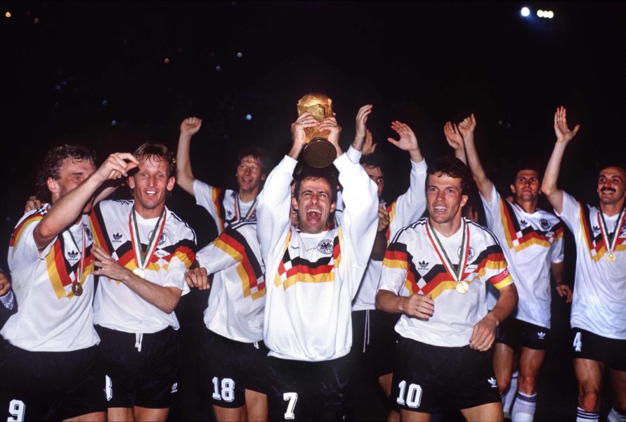 Pierre Littbarski holds up the trophy GER Lothar Matthaeus right, Rudi Voeller left, Andreas Brehme 2nd left Argentina v West Germany. World Cup Final 1990. Rome. 8/7/90. PUBLICATIONxINxGERxSUIxAUTxHUNxPOLxUSAxONLY