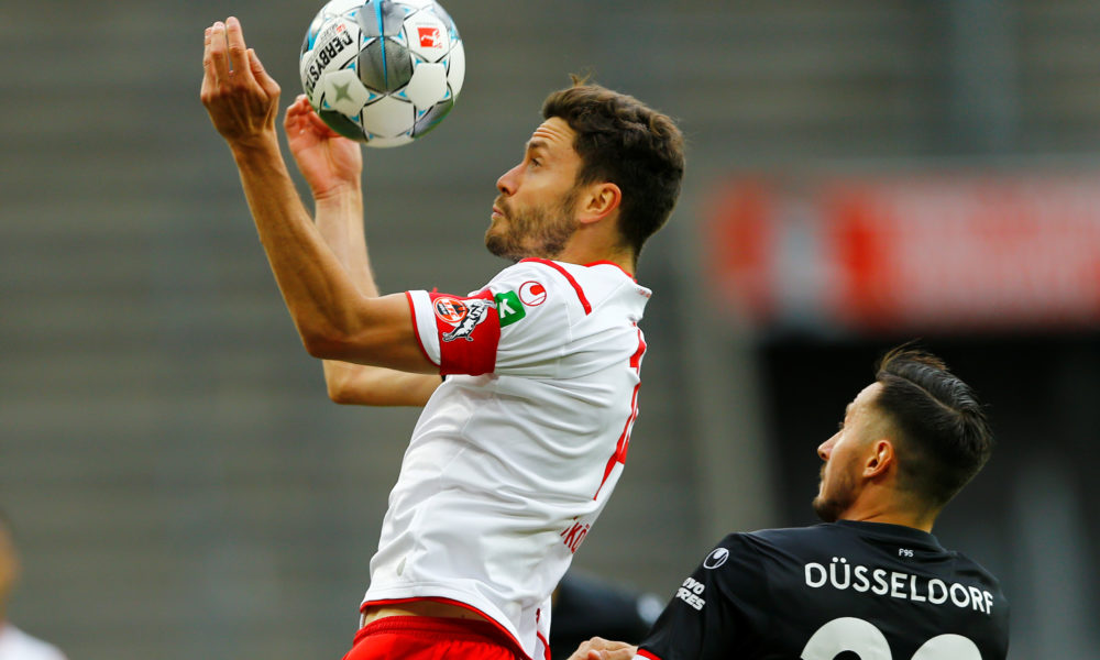Cologne's German defender Jonas Hector (L) and Fortuna Duesseldorf's German forward Steven Skrzybski vie for the ball during the German first division Bundesliga football match FC Cologne v Fortuna Dusseldorf on May 24, 2020 in Cologne, western Germany. (Photo by Thilo SCHMUELGEN / POOL / AFP) / DFL REGULATIONS PROHIBIT ANY USE OF PHOTOGRAPHS AS IMAGE SEQUENCES AND/OR QUASI-VIDEO (Photo by THILO SCHMUELGEN/POOL/AFP via Getty Images)