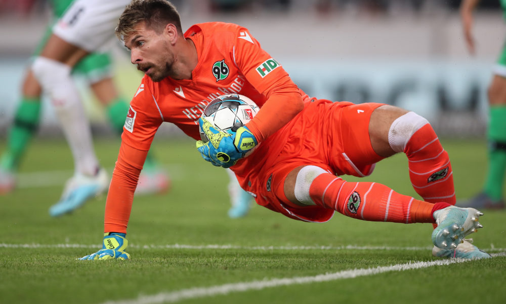 STUTTGART, GERMANY - JULY 26: Ron-Robert Zieler of Hannover 96 holds the ball during the Second Bundesliga match between VfB Stuttgart and Hannover 96 at Mercedes-Benz Arena on July 26, 2019 in Stuttgart, Germany. (Photo by Christian Kaspar-Bartke/Bongarts/Getty Images)