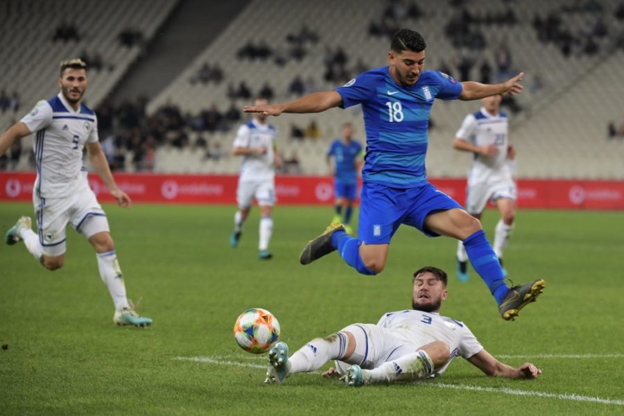 Bosnia's Ermin Bicakcic vies with Greece's Dimitris Limnios (up) during the Euro 2020 Group J qualification football match between Greece and Bosnia-Herzegovina at the OACA Spyros Louis stadium in Athens on October 15, 2019. (Photo by ARIS MESSINIS / AFP) (Photo by ARIS MESSINIS/AFP via Getty Images)