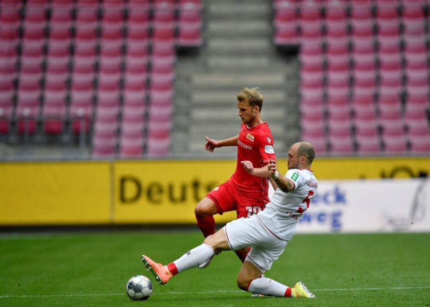 Union's Sebastian Andersson (L) vies with Cologne's Rafael Czichos during the German first division Bundesliga football match FC Cologne v FC Union Berlin on June 13, 2020 in Cologne, western Germany. (Photo by Martin Meissner / POOL / AFP) / DFL REGULATIONS PROHIBIT ANY USE OF PHOTOGRAPHS AS IMAGE SEQUENCES AND/OR QUASI-VIDEO (Photo by MARTIN MEISSNER/POOL/AFP via Getty Images)