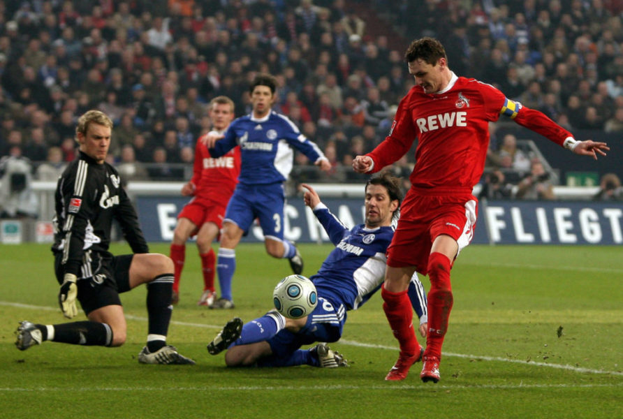 GELSENKIRCHEN, GERMANY - MARCH 06: Goalkeeper Manuel Neuer and Mladen Krstajic of Schalke battle for the ball with Milivoje Novakovic (R) of Koeln during the Bundesliga match between FC Schalke 04 and 1. FC Koeln at the Veltins-Arena on March 6, 2009 in Gelsenkirchen, Germany. (Photo by Lars Baron/Bongarts/Getty Images)