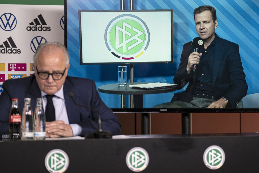 FRANKFURT AM MAIN, GERMANY - MARCH 18: DFB director for national teams and the DFB academy Oliver Bierhoff (cut in) talks to the media whilst DFB president Fritz Keller (L) looks on during a video press conference at DFB Headquarter on March 18, 2020 in Frankfurt am Main, Germany. (Photo by Thomas Boecker/DFB/Pool/Getty Images)