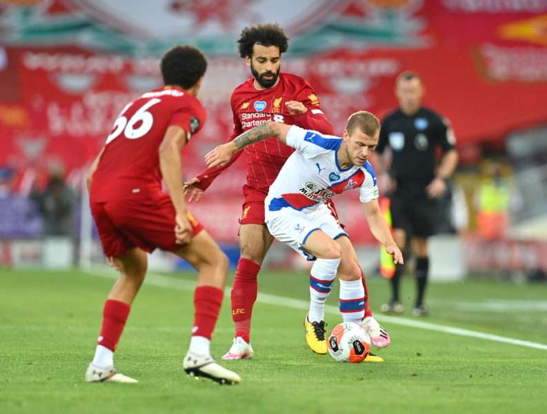 LIVERPOOL, ENGLAND - JUNE 24: Mohamed Salah of Liverpool battles for possession with Max Meyer of Crystal Palace during the Premier League match between Liverpool FC and Crystal Palace at Anfield on June 24, 2020 in Liverpool, England. (Photo by Paul Ellis/Pool via Getty Images)